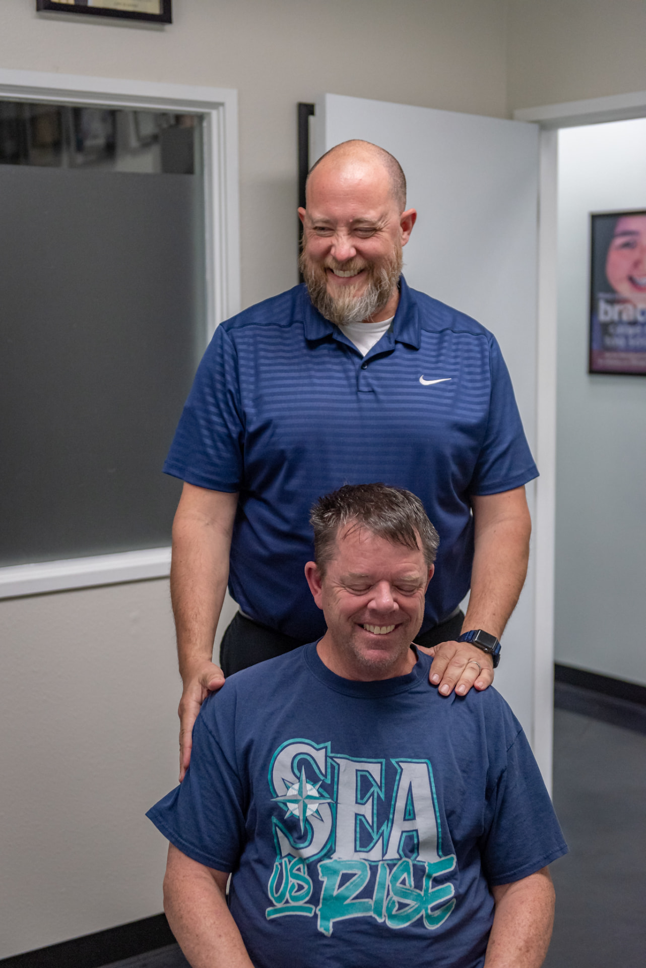 Dr. Anderson laughing with a patient in the office