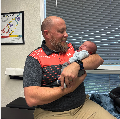 Lauryn Lambing’s newborn son being held at Discover Chiropractic